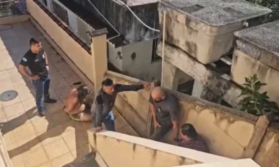 Irmaos sao presos por manterem corpo do pai por.webp